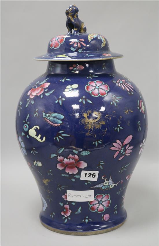 A late 19th century Chinese lidded blue ground vase